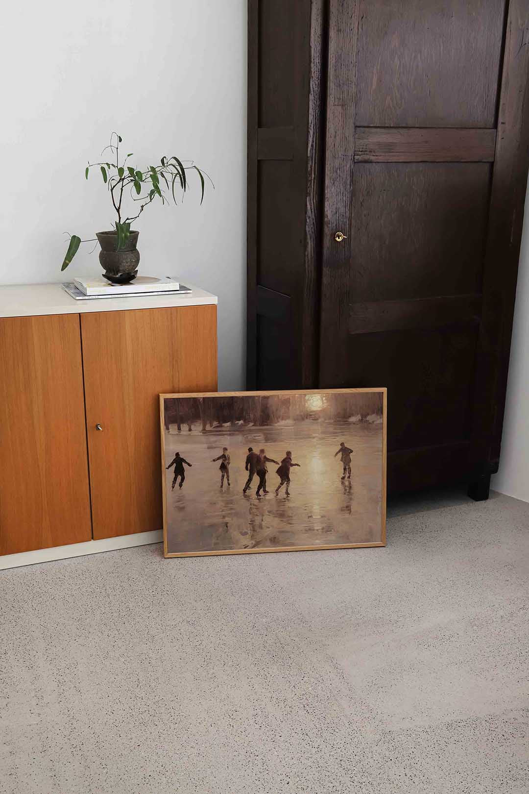 Schaatsers bij zonsondergang Poster